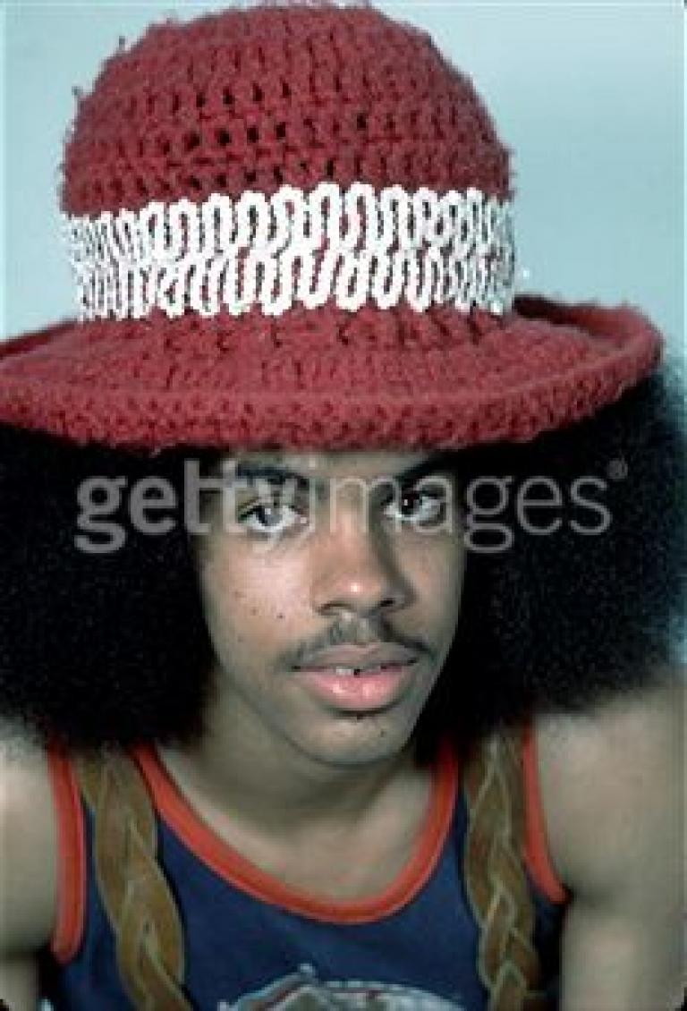a hat covering the fro