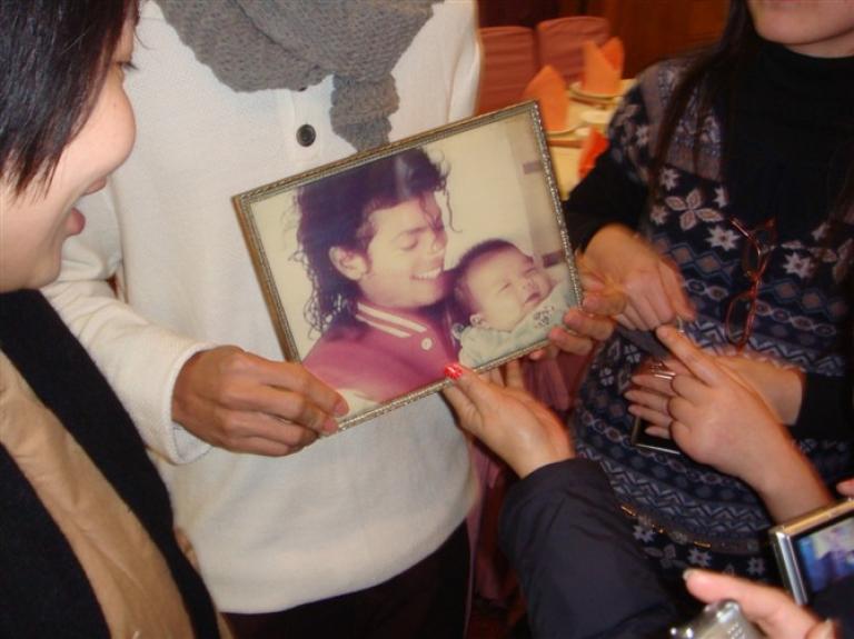 The little boy held by MJ in China