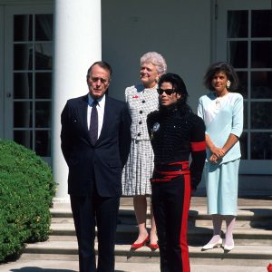 Michael Jackson stands with President George H.W. Bush and First Lady Barbara Bush at the White House where he was honored with the "Artist of the Decade" award on April 5, 1990.