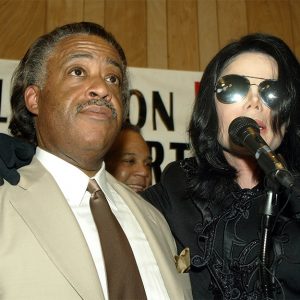 Michael Jackson with Reverend Al Sharpton at Sharpton's National Action Network headquarters in Harlem, New York, NY, in 2002.