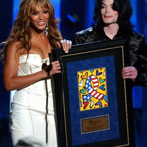 Beyonce presents humanitarian award to Michael Jackson at 2003 Radio Music Awards October 27, 2003