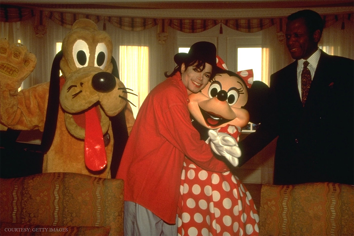 Michael Jackson and Sidney Poitier at Disneyland with Minnie Mouse and Pluto.