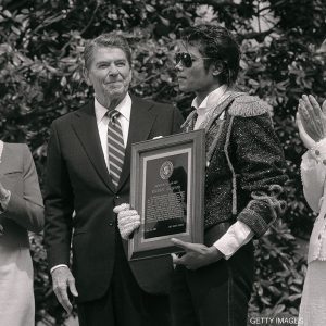 President Ronald Reagan and First Lady Nancy Reagan present Michael Jackson with Presidential Public Safety Communication Award at White House ceremony May 14, 1984
