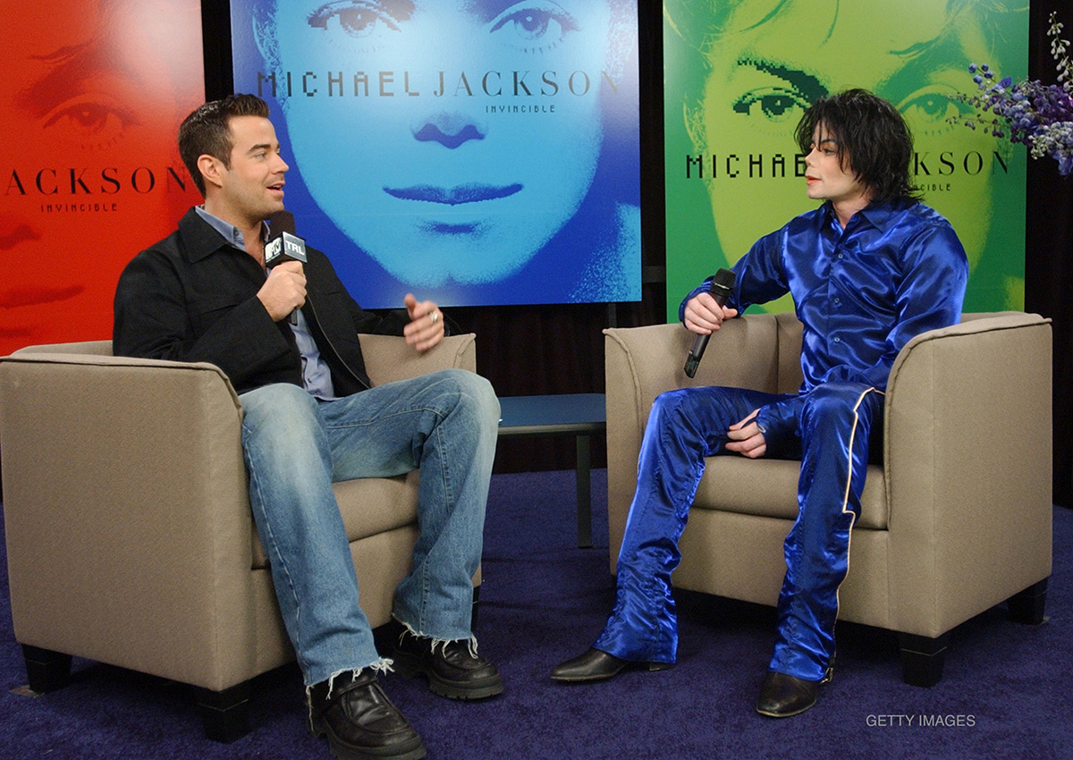 Michael Jackson and Carson Daly at in-store signing for Invincible at Virgin Megastore, Times Square in New York, NY, on November 7, 2001