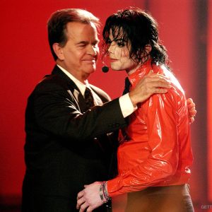 Dick Clark hugs Michael Jackson during a performance break at the taping of American Bandstand's 50th Anniversary Celebration on April 20, 2002. The show aired May 3, 2002 ﻿on ABC-TV.