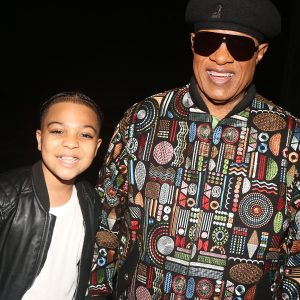 Christian Wilson, one of the two young actors who play "Little Michael" in MJ the Musical, and Stevie Wonder pose backstage at the Neil Simon Theatre in New York, NY, in May 2022.