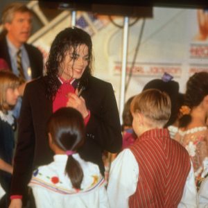 Michael Jackson with children at John F. Kennedy International Airport in New York, NY, November 11, 1992 for airlift of Michael Jackson’s Heal The World Foundation Donates Supplies To Sarajevo 1992.1 million medical supplies, blankets and clothing for Sarajevo from Heal the World Foundation