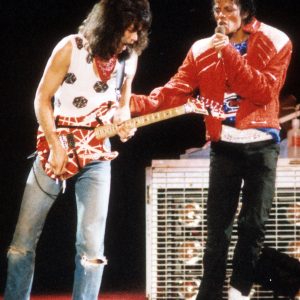 Michael Jackson is joined on stage by Eddie Van Halen to perform "Beat It" during The Jacksons Victory Tour at Texas Stadium in Dallas, Texas, on July 13, 1984.