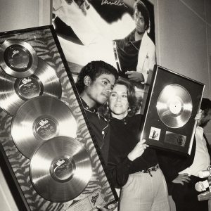 Michael Jackson, with Jane Fonda, is presented with Platinum awards for his Thriller album in the 1980s.