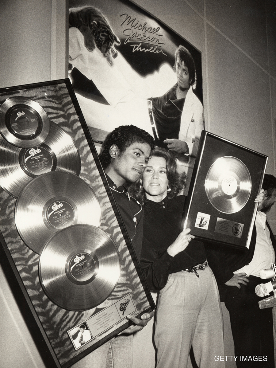 Michael Jackson, with Jane Fonda, is presented with Platinum awards for his Thriller album in the 1980s.