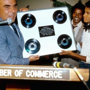 Michael Jackson receives award from Hollywood Chamber of Commerce as first solo artist with four singles from one album reach Billboard Hot 100 Top 10