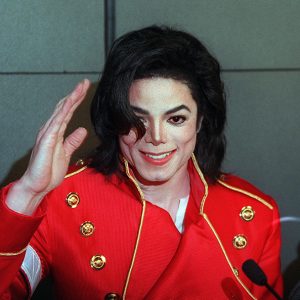 Michael Jackson waves during press conference
